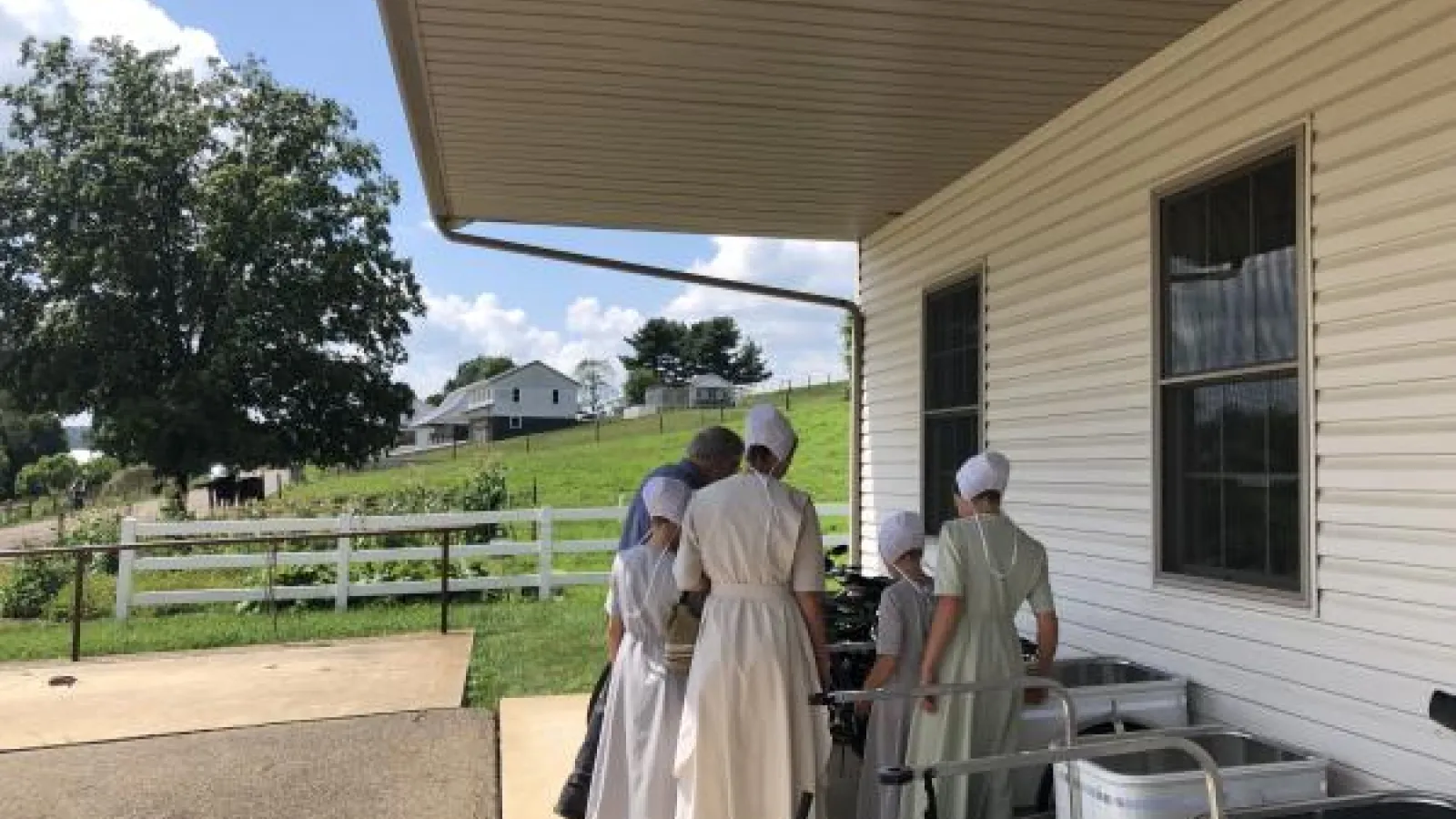 Orthodox Jewish Women standing on farm
