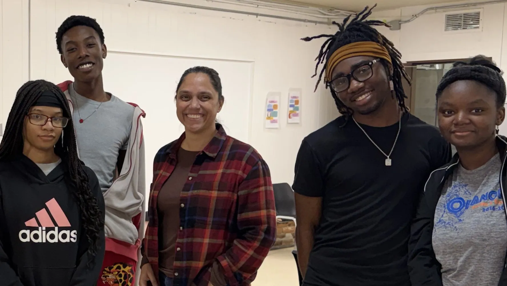 Brandy Phipps posing for a photo with students