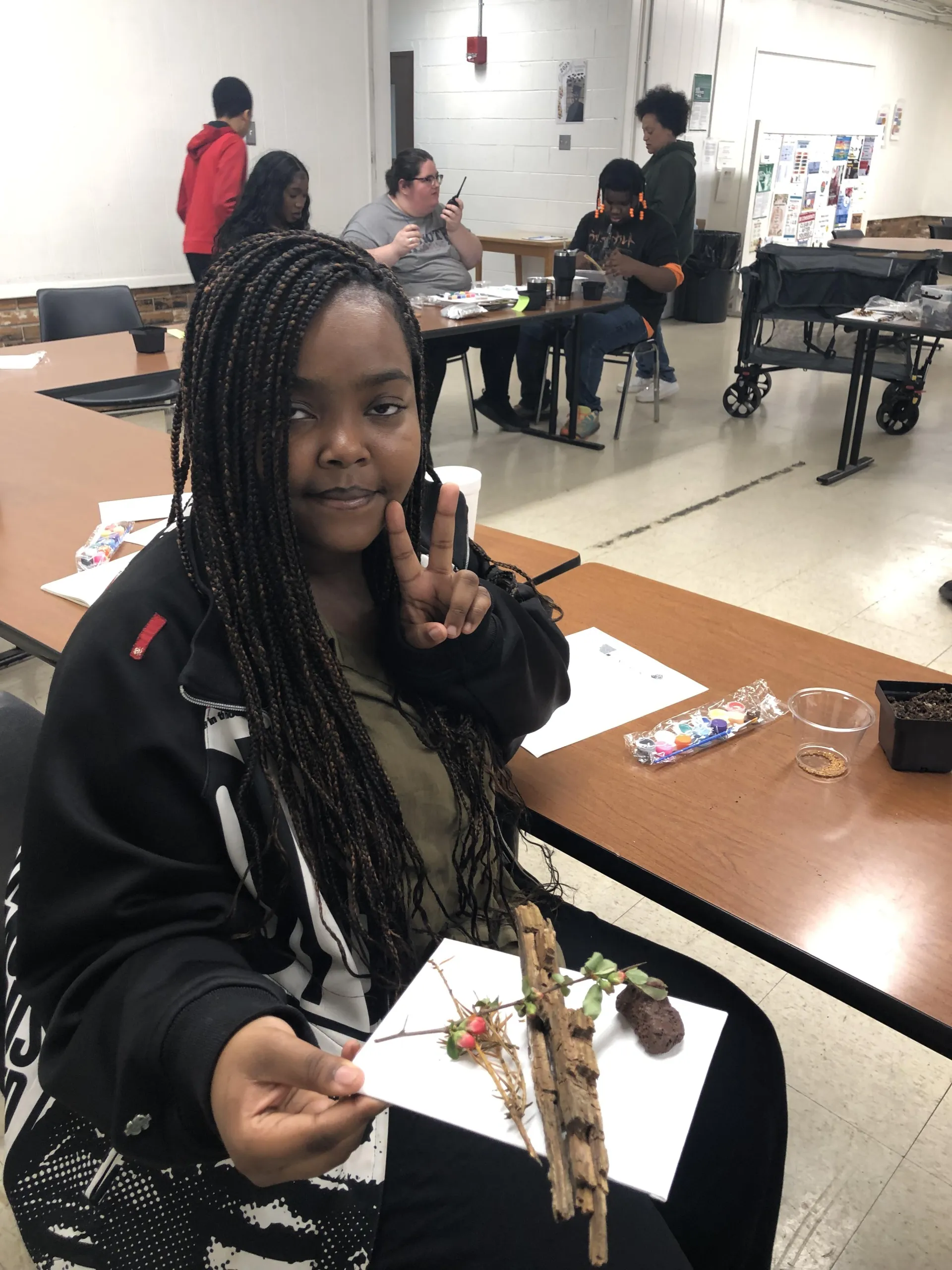 student with art project