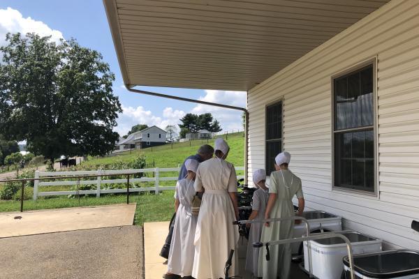 Orthodox Jewish Women standing on farm