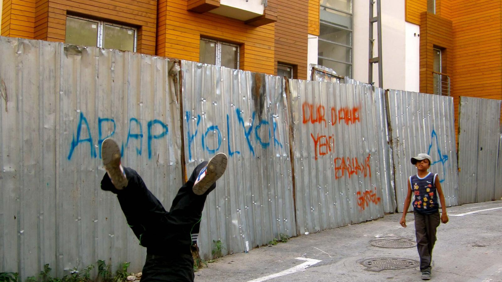 Image of break dance on Street in Istanbul.Title: "What side of the fence?" by Danielle Schoon. Published with permission of the author. All rights reserved. 