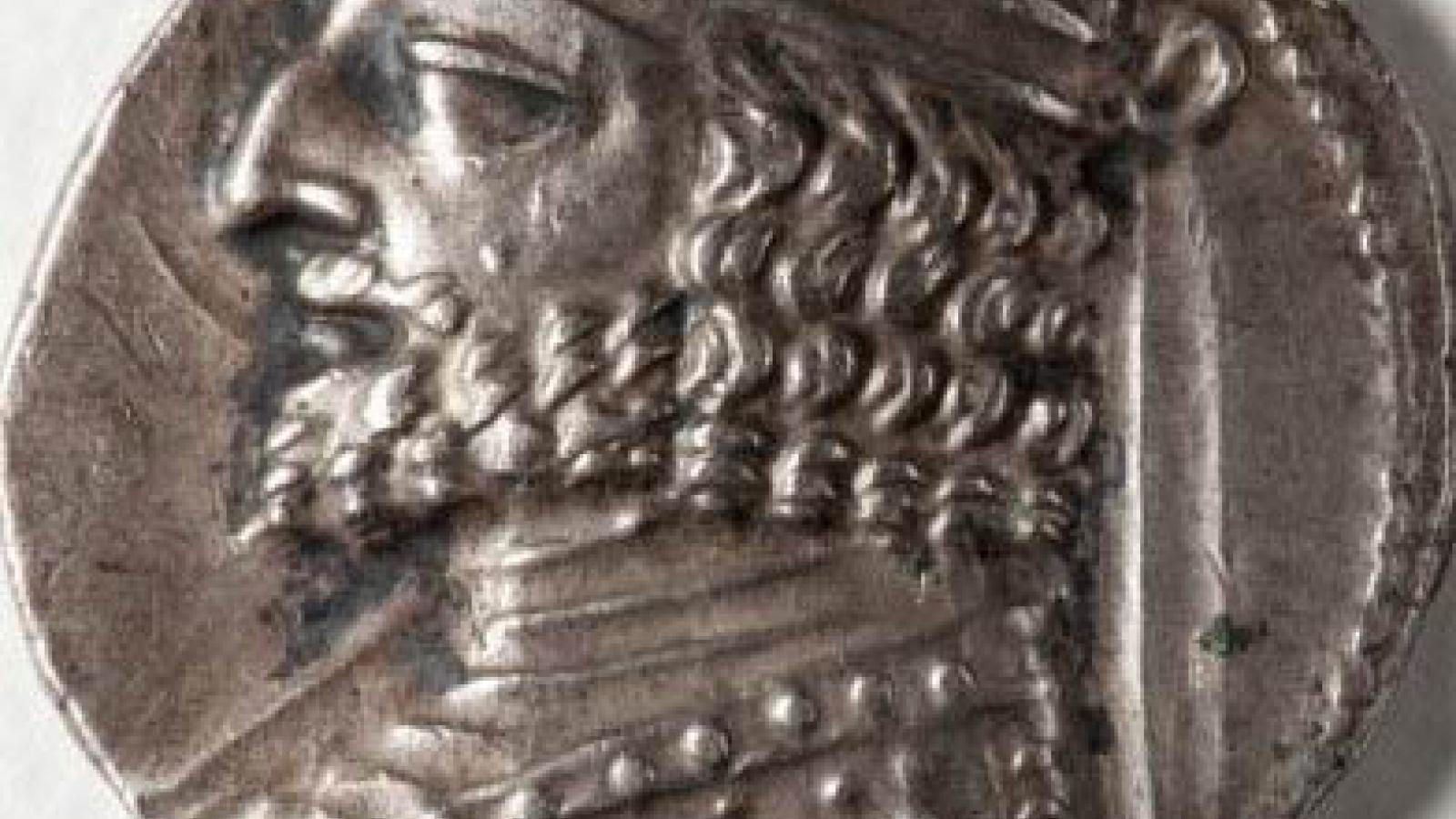 Image of ancient Iranian coin depicting head of a man. 